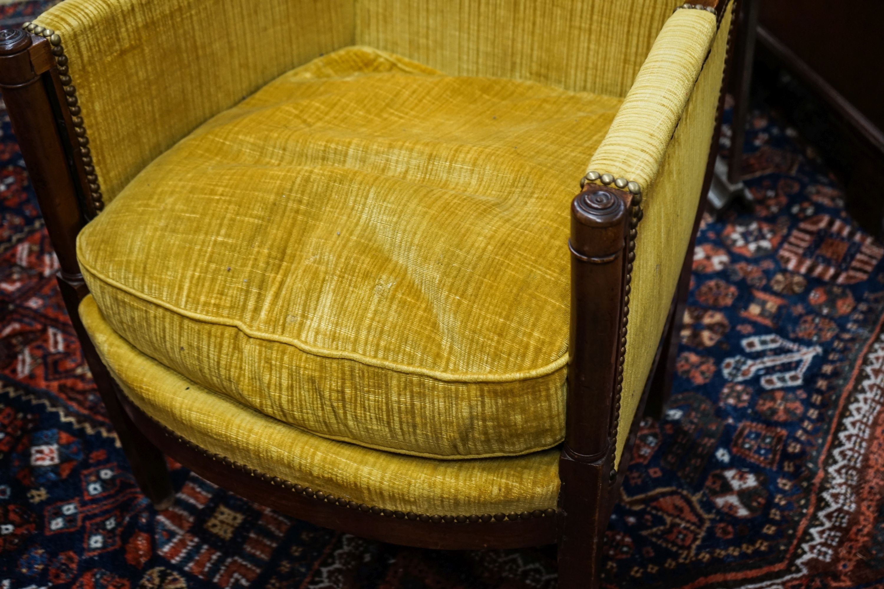 An Empire fruitwood bergere, c.1840, width 62cm, depth 52cm, height 90cm